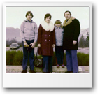 Jarek age 13 in parking lot with Mom, Dad and Renata